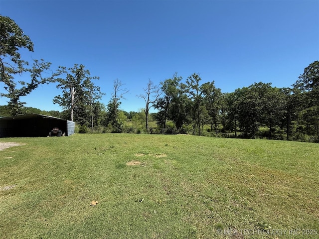 7905 Hornbeam Rd, Henryetta, OK 74437 - view of grassy yard featuring a carport