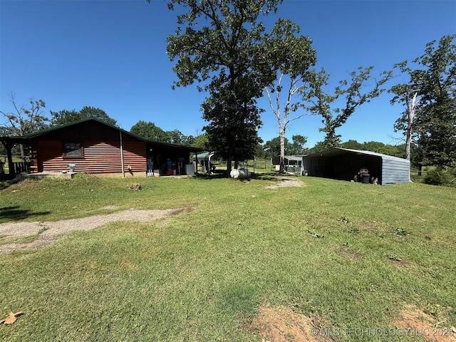 7905 Hornbeam Rd, Henryetta, OK 74437 - view of grassy yard featuring a carport