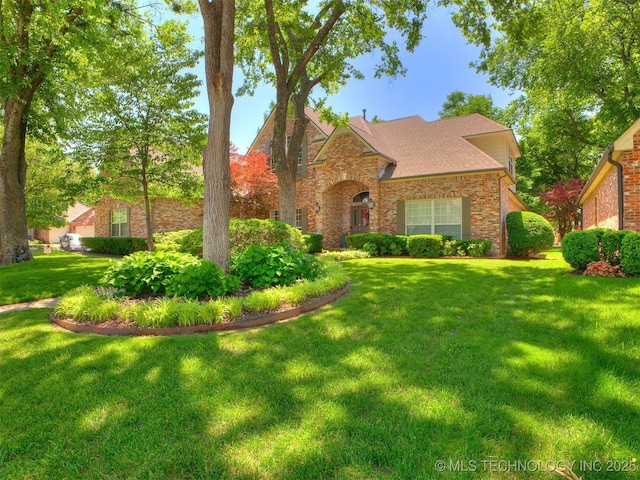609 E Pensacola St, Broken Arrow, OK 74011 - traditional home with a front yard and brick siding