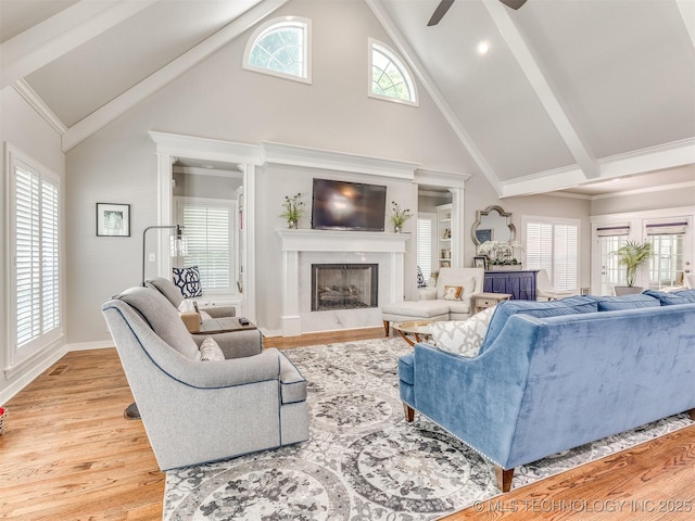 609 E Pensacola St, Broken Arrow, OK 74011 - living area with high vaulted ceiling, ceiling fan, light wood-type flooring, a premium fireplace, and baseboards