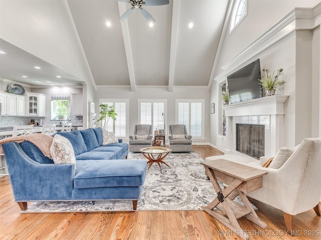 609 E Pensacola St, Broken Arrow, OK 74011 - living area featuring a fireplace, light wood-style flooring, beamed ceiling, recessed lighting, and high vaulted ceiling