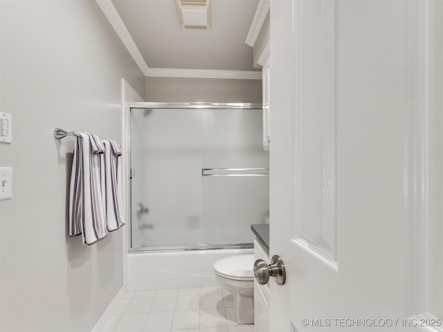 609 E Pensacola St, Broken Arrow, OK 74011 - bathroom with ornamental molding, toilet, tile patterned flooring, and shower / bath combination with glass door