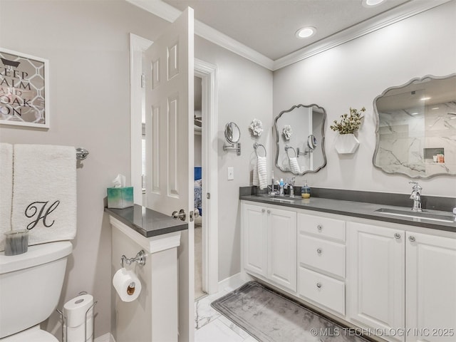 609 E Pensacola St, Broken Arrow, OK 74011 - bathroom featuring crown molding, toilet, double vanity, marble finish flooring, and recessed lighting