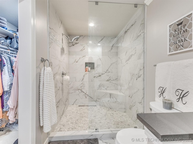 609 E Pensacola St, Broken Arrow, OK 74011 - bathroom with a marble finish shower, toilet, and marble look tile flooring