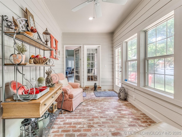 609 E Pensacola St, Broken Arrow, OK 74011 - sunroom featuring wood walls and brick floors