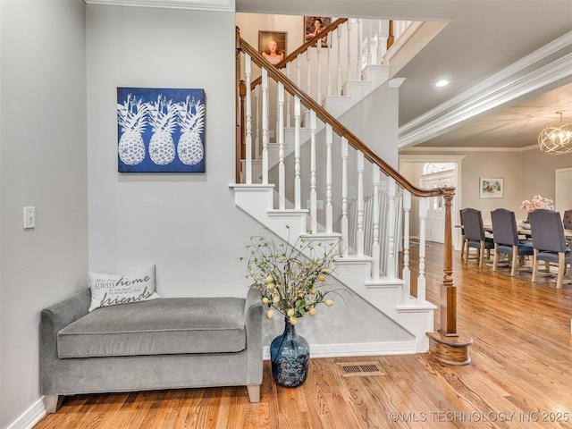 609 E Pensacola St, Broken Arrow, OK 74011 - staircase featuring ornamental molding, wood finished floors, baseboards, and a chandelier