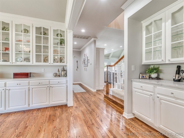 609 E Pensacola St, Broken Arrow, OK 74011 - bar with baseboards, light wood-style flooring, stairway, and ornamental molding