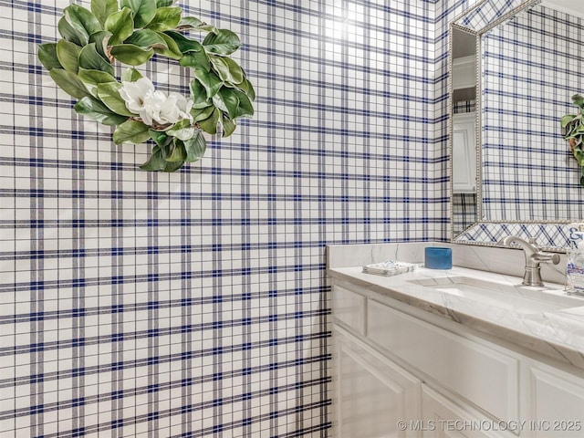 609 E Pensacola St, Broken Arrow, OK 74011 - bathroom featuring wallpapered walls and vanity
