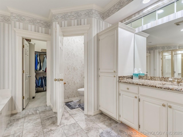 609 E Pensacola St, Broken Arrow, OK 74011 - bathroom with crown molding, wallpapered walls, vanity, toilet, and a walk in closet