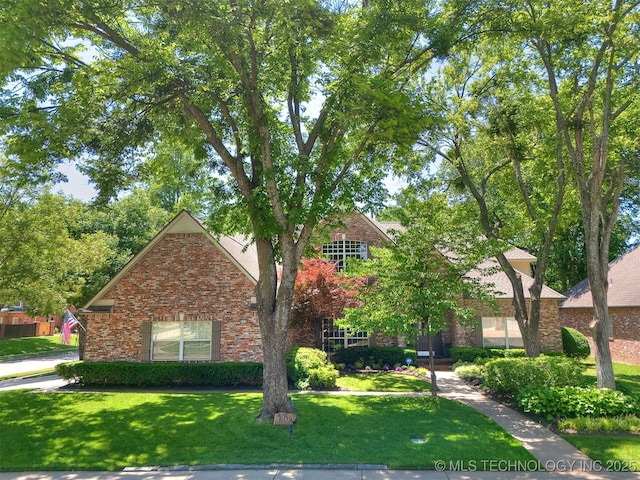 609 E Pensacola St, Broken Arrow, OK 74011 - view of front of home with a front lawn and brick siding