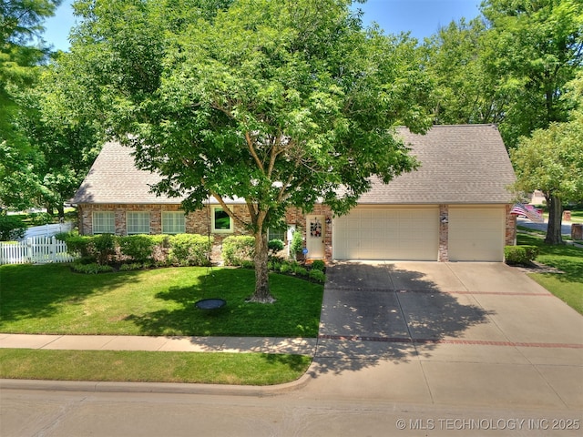 609 E Pensacola St, Broken Arrow, OK 74011 - view of front facade featuring concrete driveway, a garage, a shingled roof, and brick siding