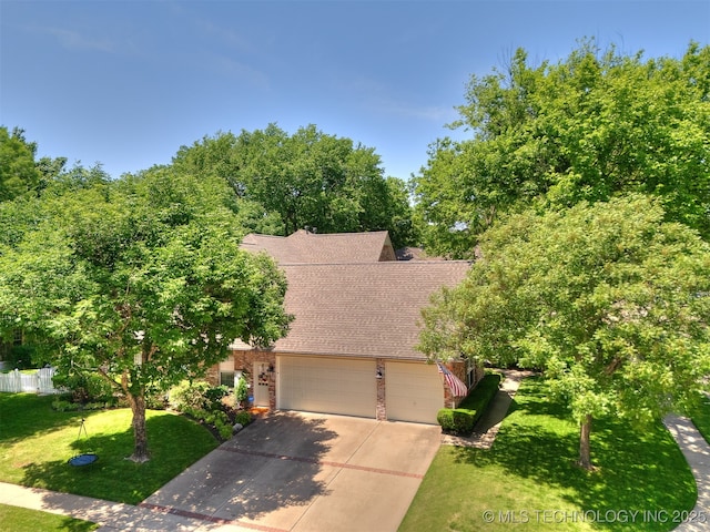 609 E Pensacola St, Broken Arrow, OK 74011 - view of front of property featuring a shingled roof, a front yard, driveway, brick siding, and an attached garage