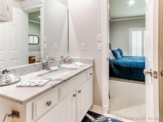 609 E Pensacola St, Broken Arrow, OK 74011 - ensuite bathroom with vanity, ornamental molding, and baseboards