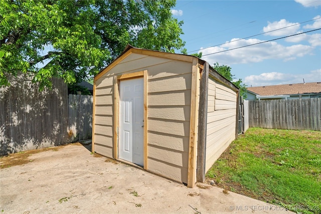 8009 E 2nd St, Tulsa, OK 74112 - view of shed with a fenced backyard