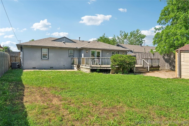 8009 E 2nd St, Tulsa, OK 74112 - back of house with crawl space, central air condition unit, a wooden deck, a shingled roof, and brick siding