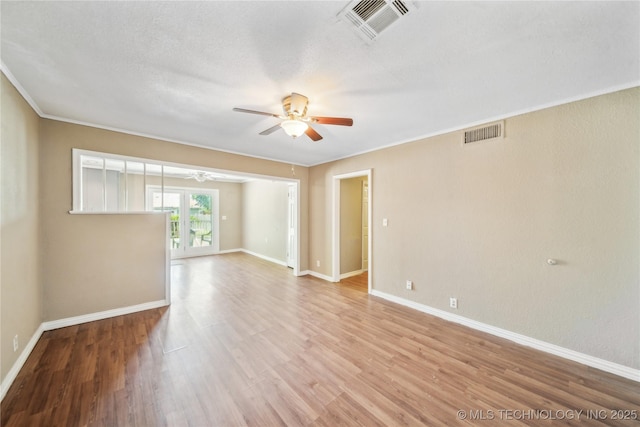 8009 E 2nd St, Tulsa, OK 74112 - unfurnished room featuring a ceiling fan, light wood-style flooring, baseboards, and ornamental molding