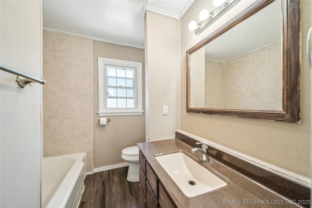 8009 E 2nd St, Tulsa, OK 74112 - full bath with vanity, toilet, wood finished floors, and ornamental molding