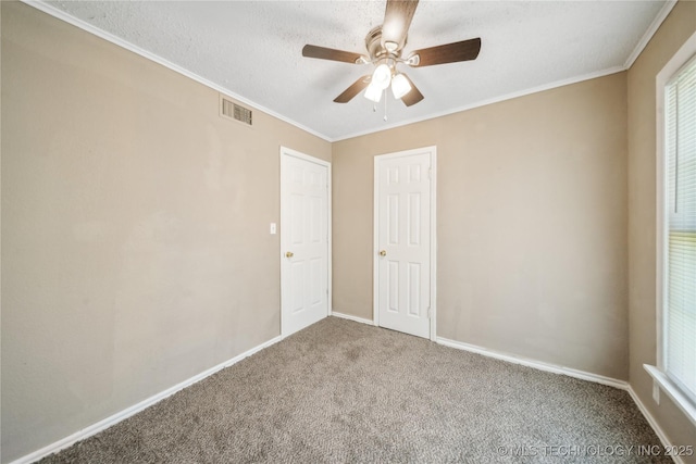 8009 E 2nd St, Tulsa, OK 74112 - carpeted spare room with ceiling fan, baseboards, and crown molding
