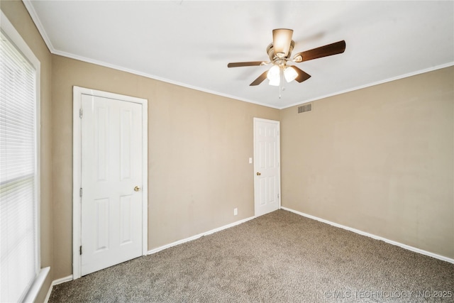 8009 E 2nd St, Tulsa, OK 74112 - unfurnished bedroom featuring carpet, baseboards, crown molding, and a ceiling fan