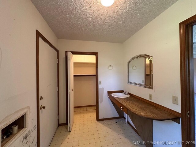 109948 S 4155th Rd, Checotah, OK 74426 - bathroom with a sink and a textured ceiling