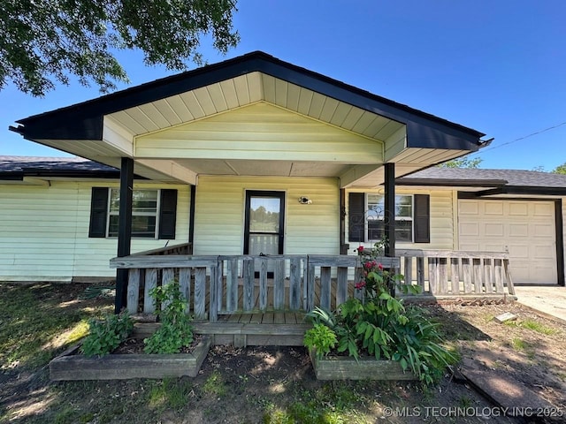 109948 S 4155th Rd, Checotah, OK 74426 - view of front of home with covered porch and an attached garage