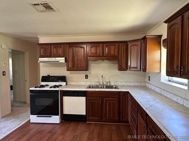 109948 S 4155th Rd, Checotah, OK 74426 - kitchen with white appliances, under cabinet range hood, a sink, dark wood finished floors, and light countertops