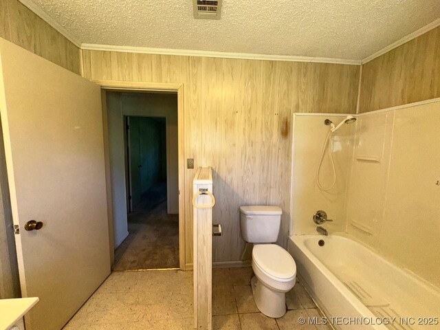 109948 S 4155th Rd, Checotah, OK 74426 - bathroom featuring toilet, a textured ceiling, ornamental molding, washtub / shower combination, and wood walls