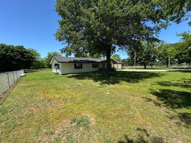 109948 S 4155th Rd, Checotah, OK 74426 - view of yard with an attached garage