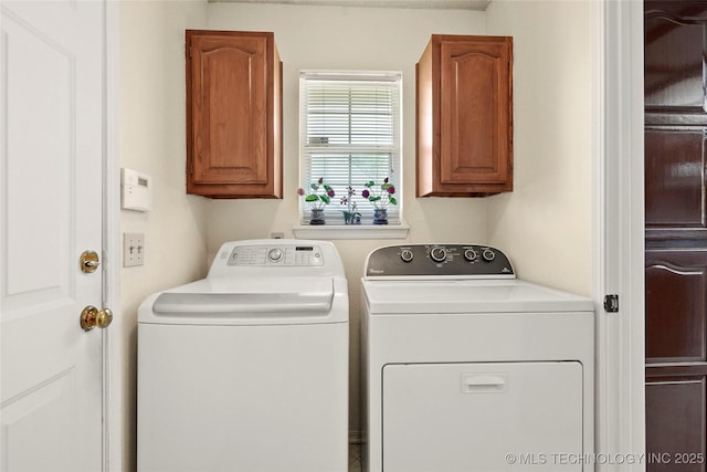 12013 E 27th St, Tulsa, OK 74129 - laundry area featuring washer and dryer and cabinet space