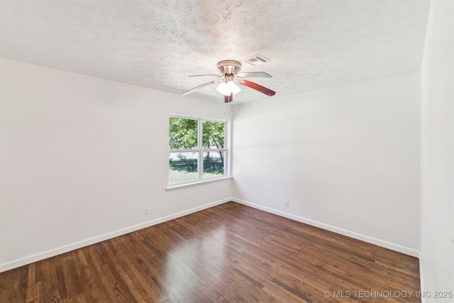 201 W 9th St, Claremore, OK 74017 - spare room with baseboards, a ceiling fan, a textured ceiling, and wood finished floors