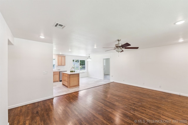 201 W 9th St, Claremore, OK 74017 - unfurnished living room featuring light wood-style flooring, a ceiling fan, recessed lighting, and baseboards