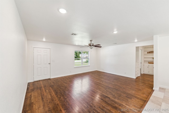 201 W 9th St, Claremore, OK 74017 - spare room featuring a ceiling fan, recessed lighting, wood finished floors, and baseboards