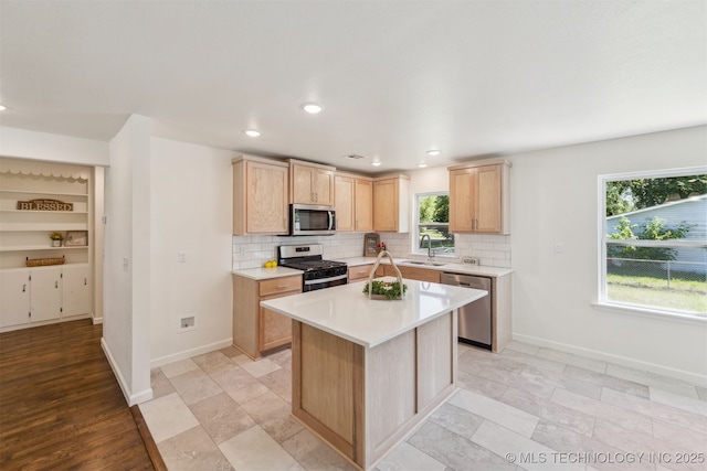 201 W 9th St, Claremore, OK 74017 - kitchen with stainless steel appliances, light brown cabinetry, a sink, baseboards, and recessed lighting