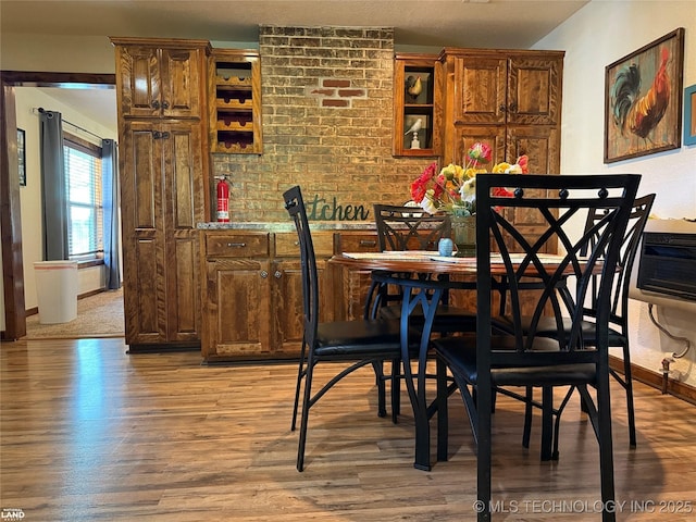 1965 Mcalester Lk, Mcalester, OK 74501 - dining area featuring wood finished floors and baseboards
