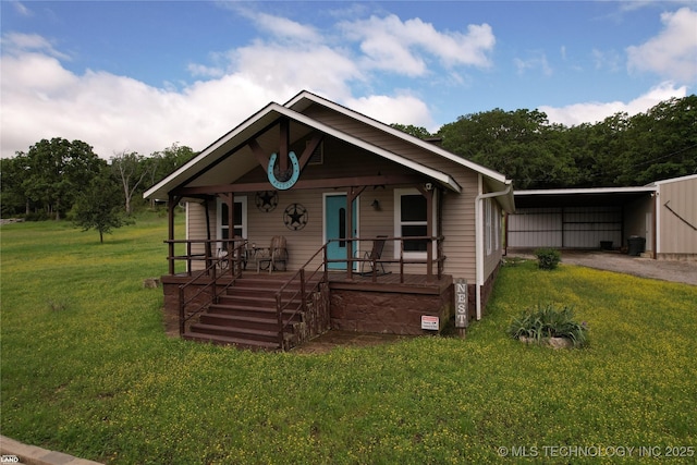 1965 Mcalester Lk, Mcalester, OK 74501 - bungalow-style home with a porch, a carport, a front lawn, and driveway
