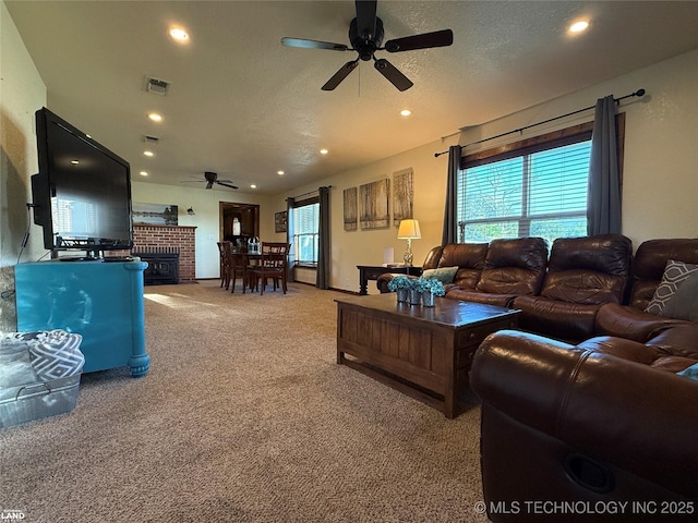 1965 Mcalester Lk, Mcalester, OK 74501 - carpeted living area featuring ceiling fan, recessed lighting, and a fireplace