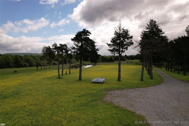1965 Mcalester Lk, Mcalester, OK 74501 - surrounding community with a lawn and a water view