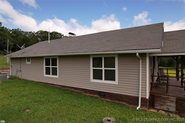 1965 Mcalester Lk, Mcalester, OK 74501 - view of home's exterior featuring a yard, central AC unit, a wooden deck, and roof with shingles