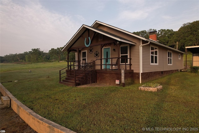 1965 Mcalester Lk, Mcalester, OK 74501 - view of front of home with a chimney, a front yard, and a porch