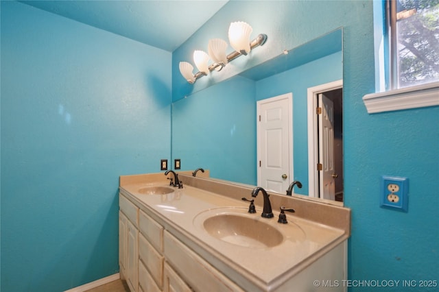 10511 S 83rd Cir, Tulsa, OK 74133 - full bath featuring double vanity, a textured wall, and baseboards