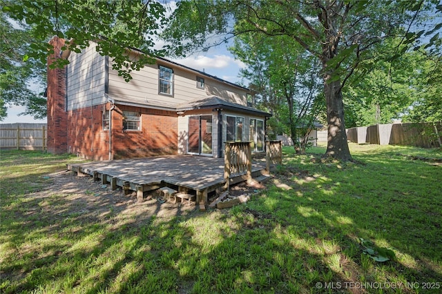 10511 S 83rd Cir, Tulsa, OK 74133 - back of house with brick siding, a wooden deck, a chimney, and a sunroom