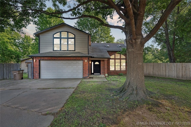 10511 S 83rd Cir, Tulsa, OK 74133 - view of front of property featuring an attached garage, concrete driveway, brick siding, and a shingled roof