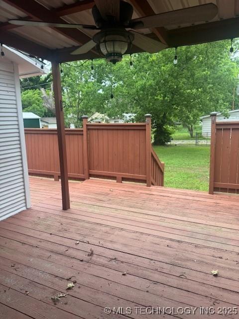 804 W Taliaferro, Madill, OK 73446 - wooden deck with a ceiling fan and a lawn