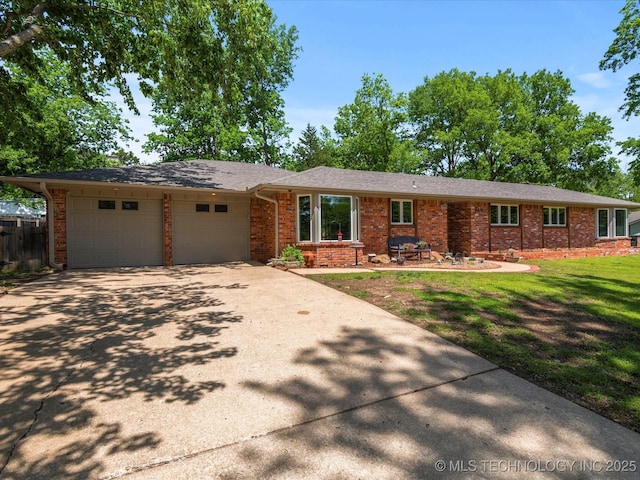 2318 Dorchester Dr, Bartlesville, OK 74006 - ranch-style home featuring a garage, concrete driveway, and brick siding