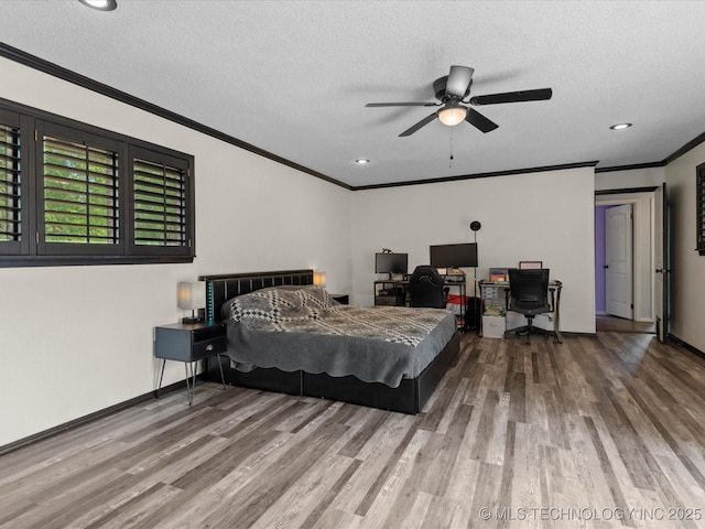 2318 Dorchester Dr, Bartlesville, OK 74006 - bedroom with ornamental molding, wood finished floors, a textured ceiling, a desk, and recessed lighting
