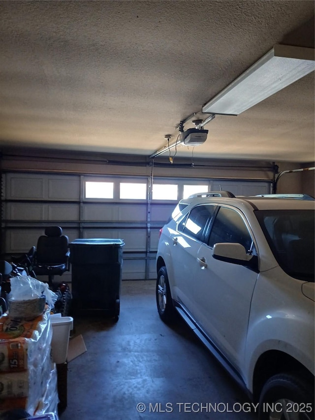 715 Kiowa, Hartshorne, OK 74547 - garage featuring a garage door opener