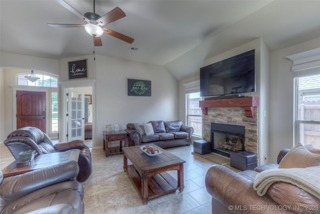10216 N 120th E Ave, Owasso, OK 74055 - living area featuring a ceiling fan, a fireplace, and vaulted ceiling