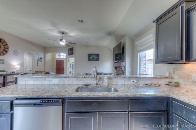 10216 N 120th E Ave, Owasso, OK 74055 - kitchen featuring stainless steel dishwasher, a sink, open floor plan, a ceiling fan, and arched walkways