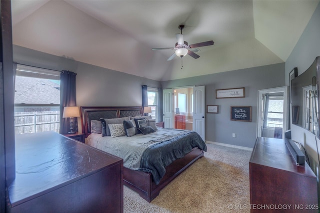 10216 N 120th E Ave, Owasso, OK 74055 - bedroom featuring multiple windows, lofted ceiling, carpet floors, ensuite bathroom, and baseboards
