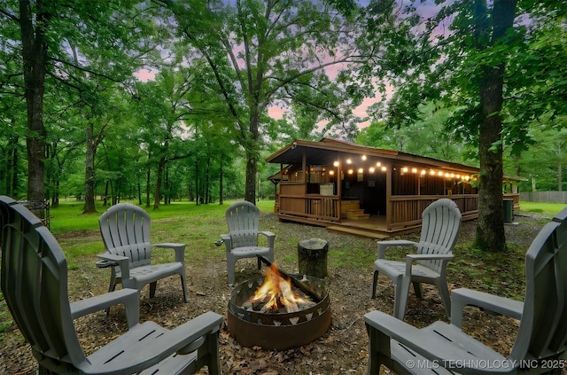 47 Tahnee Ln, Broken Bow, OK 74728 - yard at dusk featuring a fire pit